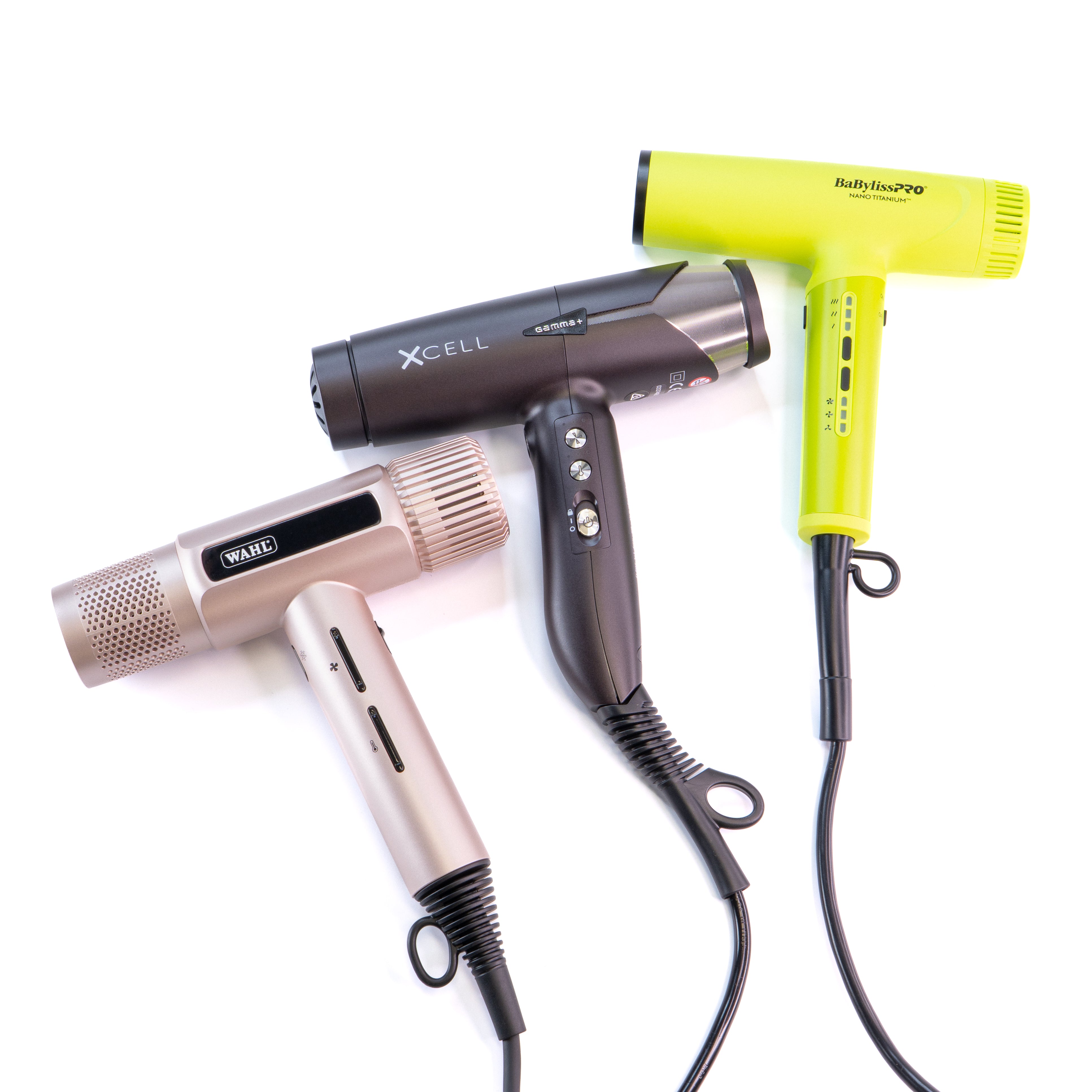 Three hair dryers of different designs and colors on a white background