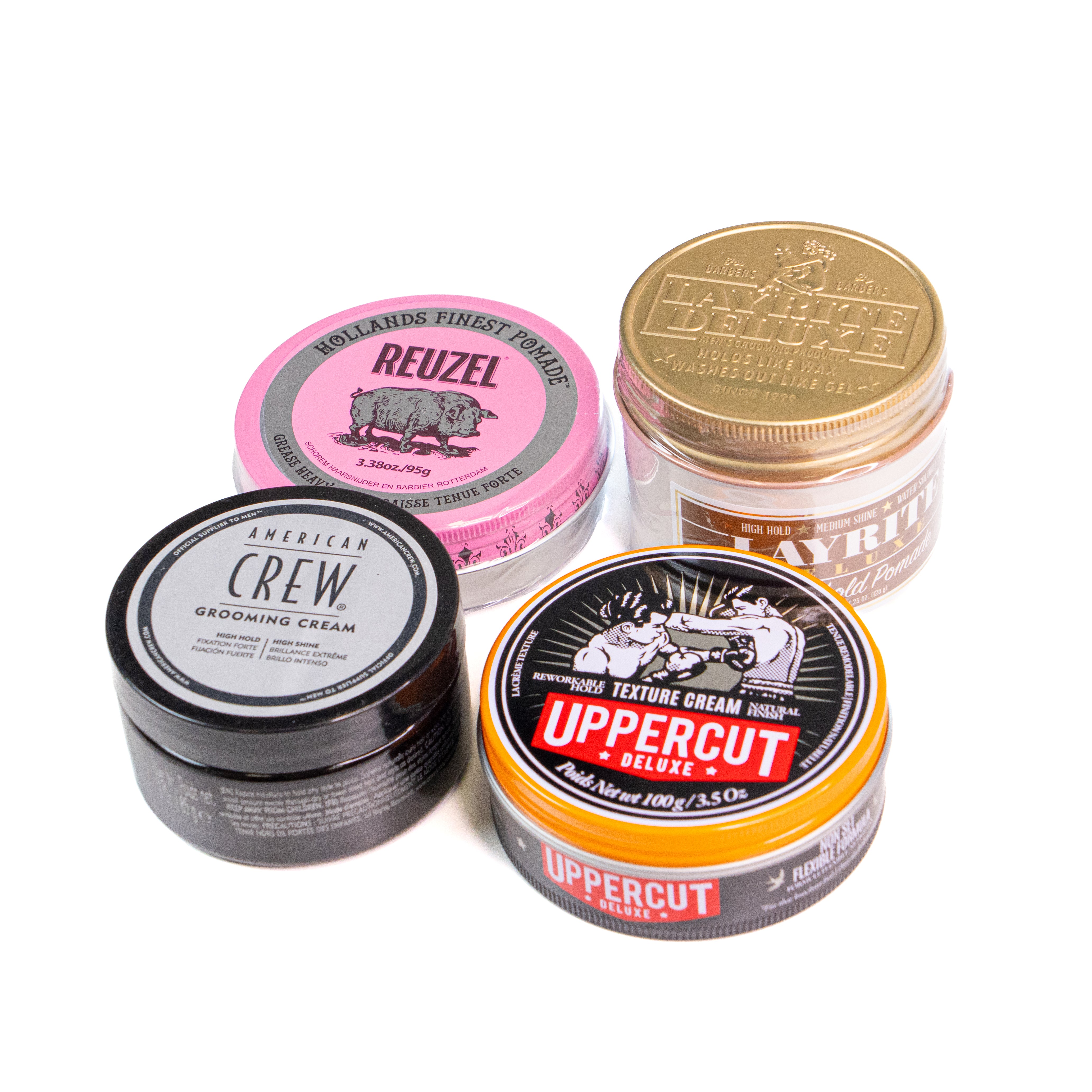 Four hair product jars from different brands on a white background